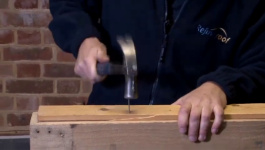 Hammer and nail input frame