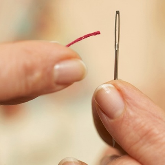 Threading needle input frame